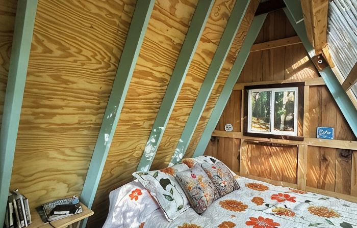 Charming A-frame cabin set in the woods overlooking deep wooded ravines.