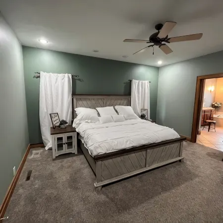 Fully custom modern four bedroom home on 13 acres with a stocked pond.