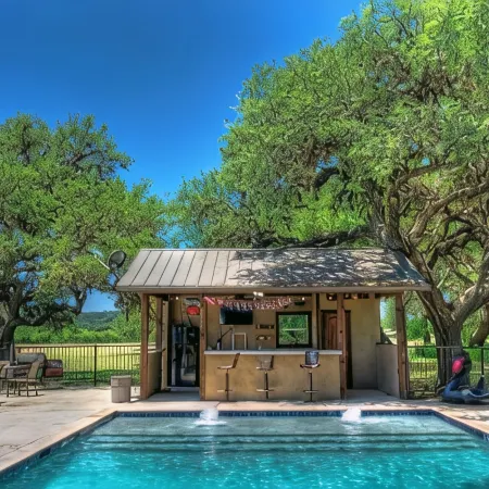 6-bedroom Lodge on 12 acres in Concan, Texas.  Swimming pool & hot tub.