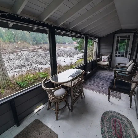 Riverside Mid-Century Cabin with Mountain Views