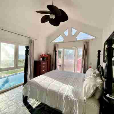 Villa Flamingo; Sleeps 8; Waterfall, Oceanfront Pool, Hot Tub Rooms