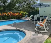 Tropical Gardens and Serene Community Amenities - Charming Island Retreat