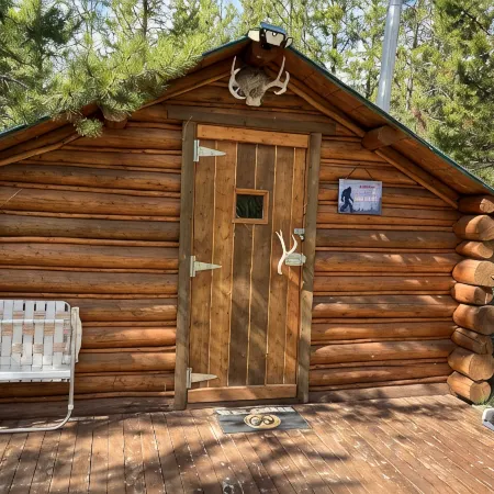 Retreat to our cozy cabin nestled in a private hideaway.Solar lights & shower