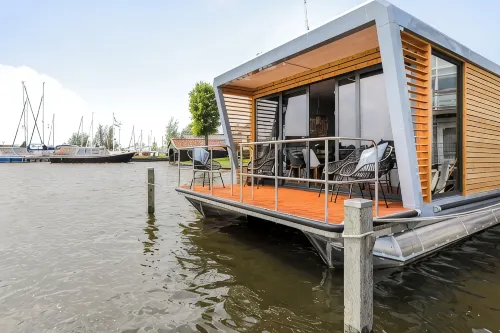 Houseboat Skoft with beautiful view over the water and on village Grou.
