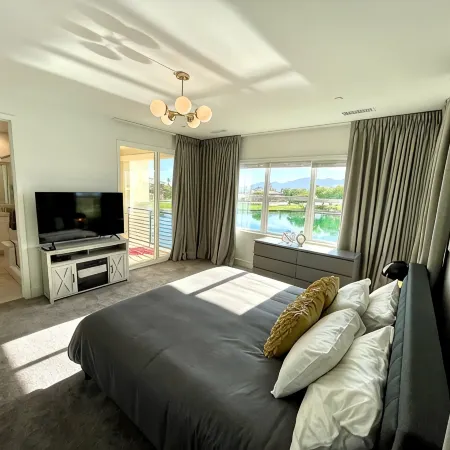 "Luxury Lakefront Paradise: Heated Pool Haven with Unrivaled Views"