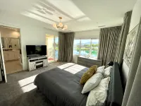 "Luxury Lakefront Paradise: Heated Pool Haven with Unrivaled Views"