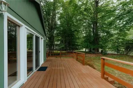 Cozy lakeside cottage with modern furniture on a quiet street.