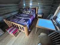 Retreat to our cozy cabin nestled in a private hideaway.Solar lights & shower