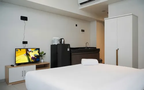 Studio Apartment with Sofa at Carstensz Residence by Travelio