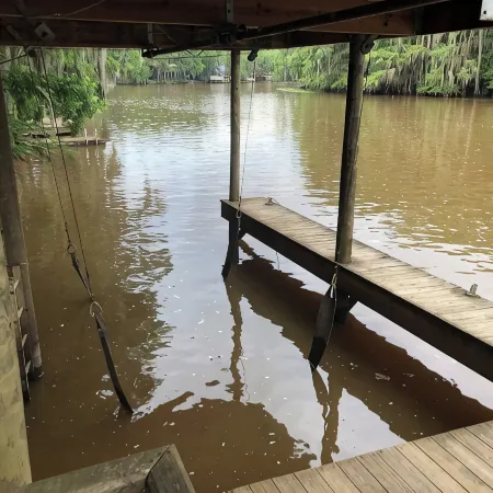 Two Story House with Deck over the River