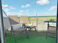 Modern vacation apartment with direct view of the North Sea and swimming pool