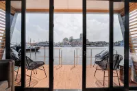 Houseboat Skoft with beautiful view over the water and on village Grou.