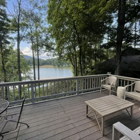 Breathtaking lake views, steps from beach, golf, and clubhouse. Renovated home!