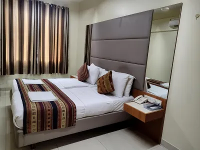 Empire Hotel Отели рядом с достопримечательностью «Mani Bhavan Gandhi Museum»
