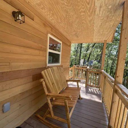 Cowboy Cabin is Nestled in a Little Woodland Village – Playground, Pond and More