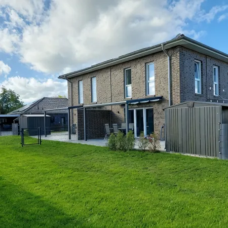 NEW! modern, high-quality, central apartment, with sauna, garden, wallbox in Burhave