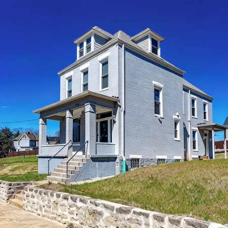 Musketeer Manor ~ 5 bedrooms & 4.5 baths off street parking & central location!!