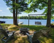 NEW! Renovated Bungalow steps from Lake Tomahawk - King Bed, Dock Space, Firepit - 4-Star