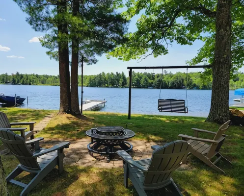 NEW! Renovated Bungalow steps from Lake Tomahawk - King Bed, Dock Space, Firepit
