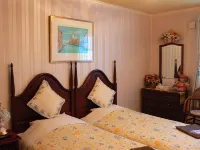 Petit Hotel Corinthian Hotels in Rebun