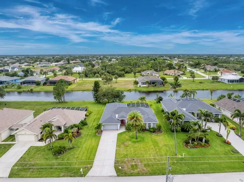 Newly Remodeled 4BR/3BR Canal Front Retreat w/ Pool Near Golf Course & Beach FL - 4-Star