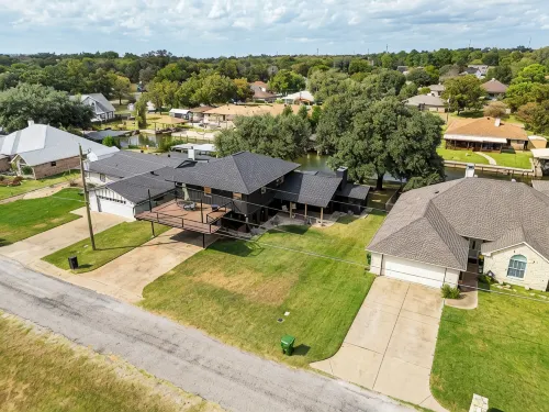 Rockstar waterfront lake house! Mid century modern with large 2 story party deck