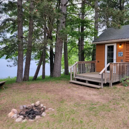 Rustic cabin getaway on the shore of Soo Lake in Phillips, WI