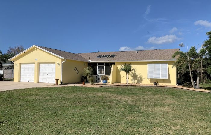 Waterfront single home rental with private lanai, heated pool, and hot tub!