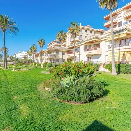 Beachfront Apartment in Lubina del Sol | Pool, Padel, Parking &  Beach Access