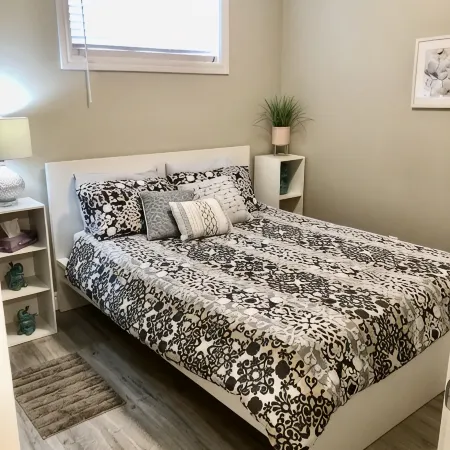 Cozy 2 bedroom basement with 2 beds, kitchen, 75’’ TV and bathroom