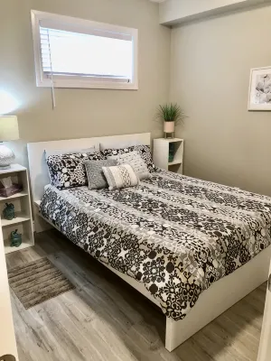 Cozy 2 bedroom basement with 2 beds, kitchen, 75’’ TV and bathroom