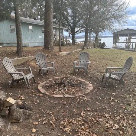 Peaceful lake front home with wrap around porch and relaxing views!