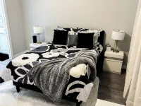 Modern 2-bed, 2-bath home with WiFi, Smart TVs, coffee, tea, and cereal included