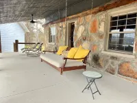 The Stone Schoolhouse - Gated Lakefront Acreage with views and historic charm