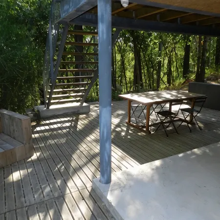 Wooden house in the golf, between forest, lake and ocean