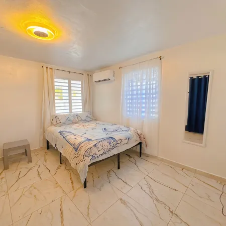 Charming 3-bedroom Beach House with AC and WiFi near Arecibo's best beaches.