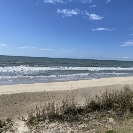 Enjoy an oceanfront getaway with beautiful beach steps from your door.