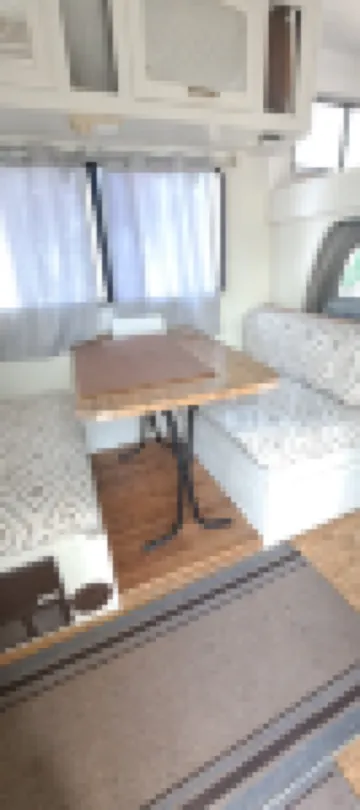 Cute RV in the  forested mountains at Cedar Ridge,  Sonora for your vacation.