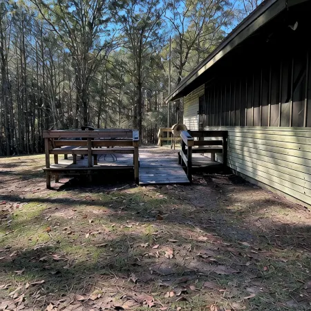 3-bedroom cabin nestled on 80 acres with WiFi, AC on private 5-acre lake.