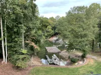Lakefront Custom Home /w Private Dock on Cove.  Finished Basement.  2 Kitchens - 4-Star