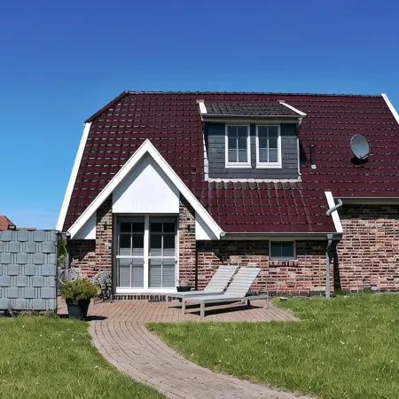 Dream vacation home NordseeStar with fireplace and lounge in Neßmersiel