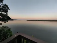Spectacular lake view with a huge deck and a Hot Tub.
