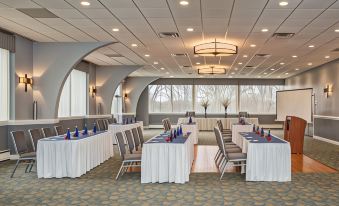 a large conference room with multiple tables and chairs arranged for a meeting or event at The Kenilworth