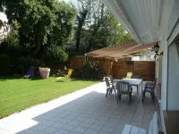 Spacious apartment in villa with large private garden and terrace near the sea