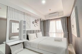 Grey Toned 1BR Apartment Tamansari Skylounge Makassar By Travelio