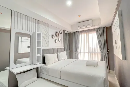 Grey Toned 1BR Apartment Tamansari Skylounge Makassar By Travelio - Apartments
