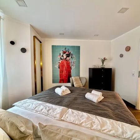 Stylish granny apartment with box-spring bed
