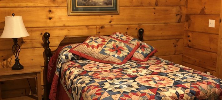 Cozy Cabin in the Woods in a Relaxing Area with Wrap Around Porch Rocking Chairs Hotels in Scott County