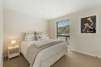 Warm and stylish new home close to river, lake, restaurants and golf course.