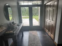 BEAUTIFUL lake front home with a private beach, dock and large yard